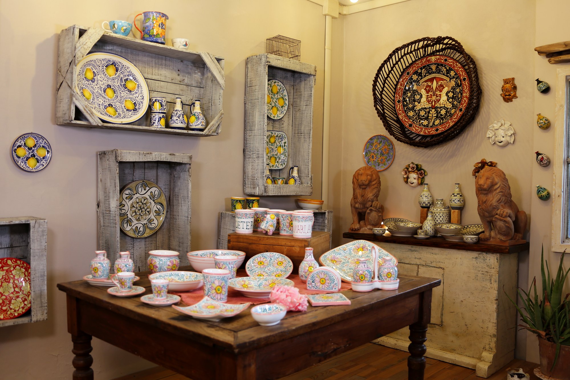 The central table of the workshop with a hand-painted dinner set